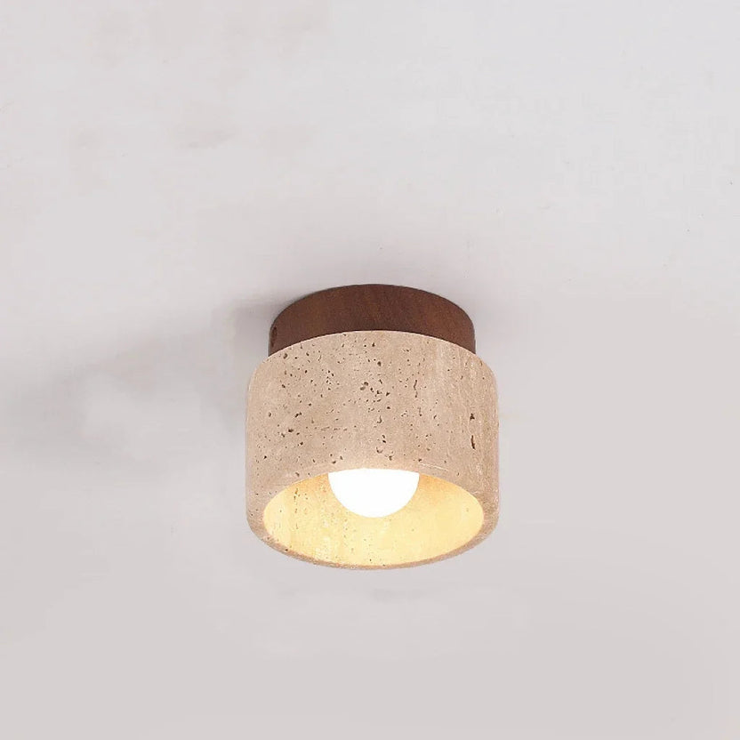 Cette élégante applique murale allie la chaleur du bois et la texture brute de la pierre naturelle, offrant une lumière douce et diffuse. Idéale pour ajouter une touche contemporaine et organique à n'importe quel espace intérieur.