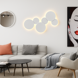 Halo lumineux créé par le disque sur le mur