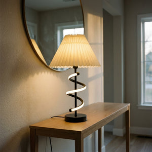 Lampe de table Hélia sur une console d'entrée sous un miroir rond, ambiance chaleureuse